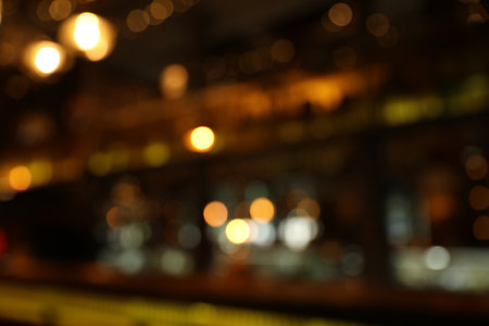 Blurred view of stylish modern bar interior with bokeh effectの写真素材