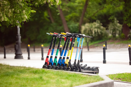 Row of electric scooters in the park. rental serviceの写真素材