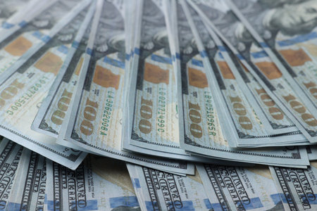 Dollar banknotes as background, closeup view. money exchange