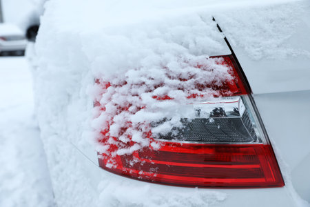 Modern car covered with snow outdoors on winter day, closeup. frosty weatherの写真素材