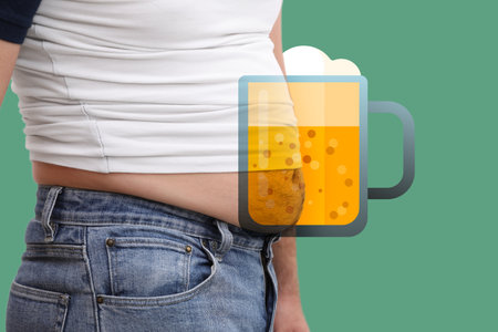 Beer belly problem. Overweight man on green background, closeupの写真素材