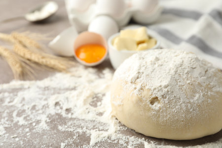 Wheat dough and products on table, closeup view with space for text. Cooking pastriesの写真素材