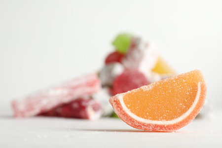 Sweet jelly slice on white table. Space for text