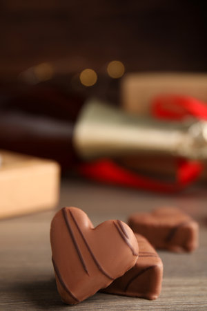 Tasty heart shaped chocolate candies on wooden table, closeup. happy valentines dayの写真素材