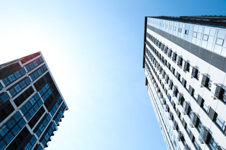 Low angle view of modern buildings on sunny dayの写真素材