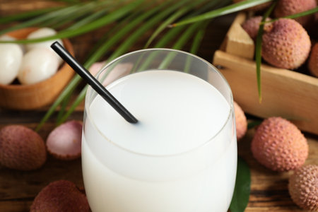 Freshly made lychee juice on wooden table, closeupの写真素材