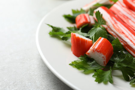 Crab sticks and parsley on light table, closeupの写真素材