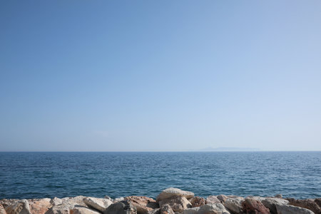 Beautiful view of rocky beach and calm sea on sunny day