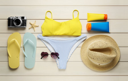 Different beach objects on white wooden background, flat layの写真素材