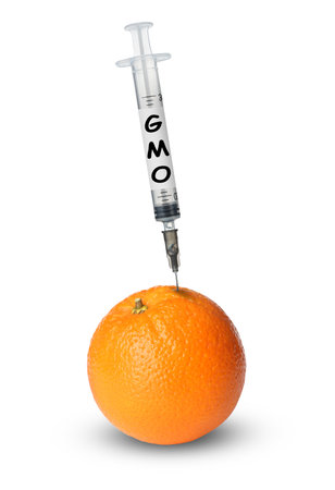 Syringe with label GMO in tangerine on white backgroundの写真素材