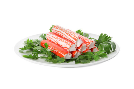Plate with crab sticks and parsley on white backgroundの写真素材