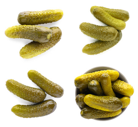 Set with tasty pickled cucumbers on white background, top viewの写真素材