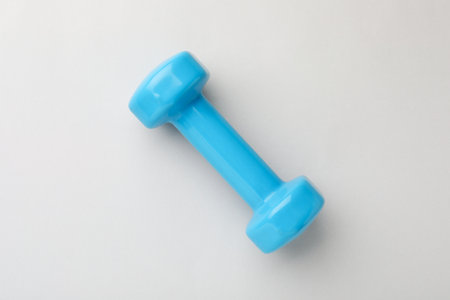 Blue vinyl dumbbell on light background, top viewの写真素材