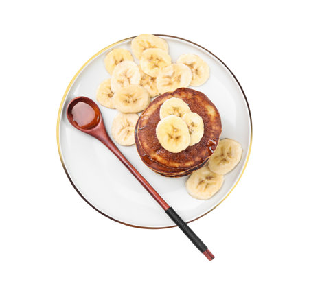 Plate of banana pancakes with honey isolated on white, top viewの写真素材