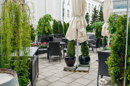 Many tables and comfortable chairs in outdoor cafeの写真素材