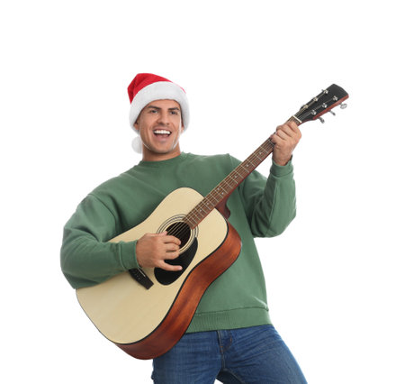 Man in Santa hat playing acoustic guitar on white background. christmas musicの写真素材