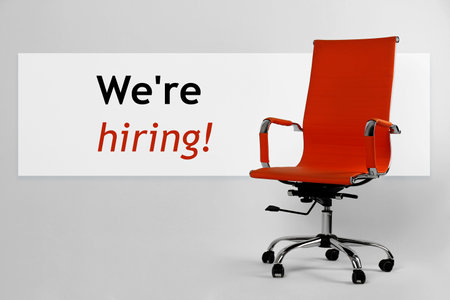 We`re hiring! Red office chair on light gray backgroundの写真素材