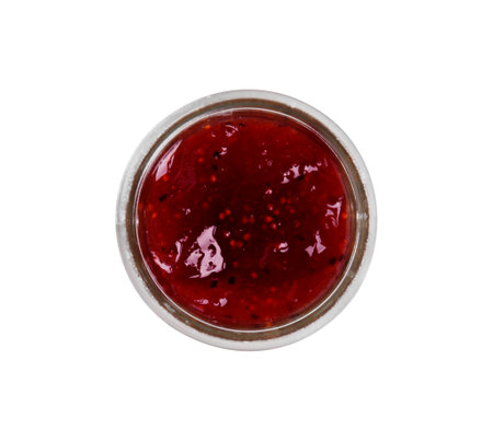 Glass jar of tasty sweet fig jam isolated on white, top viewの写真素材
