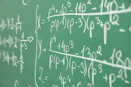 Many different math formulas written on chalkboard, closeupの写真素材