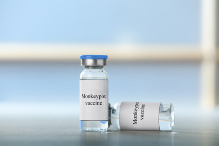 Monkeypox vaccine in vials on table, space for textの写真素材