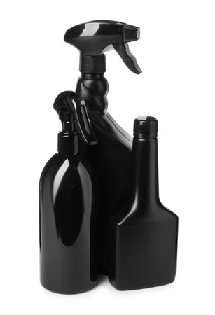 Black plastic spray bottles on white backgroundの写真素材