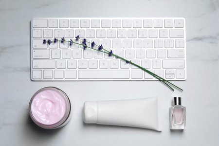 Flat lay composition with different hand care cosmetic products on white tableの写真素材
