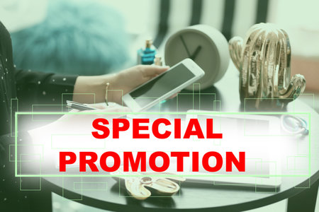 special promotion. Woman using smartphone at table indoors, closeup
