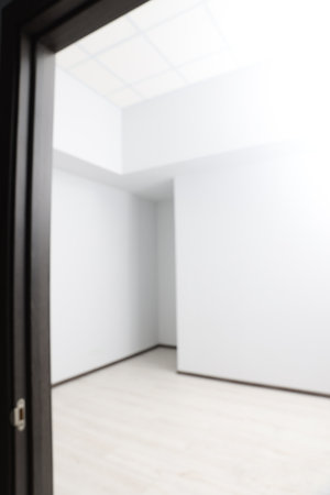 Blurred view of empty office room with white walls. interior designの写真素材