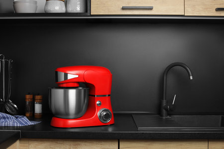 Modern stand mixer on countertop in kitchen. home appliancesの写真素材
