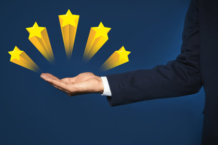 Man showing icons of five stars on blue background, closeup. quality rating