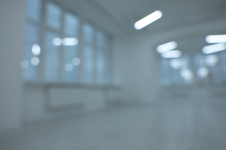 Blurred view of new empty room with windowsの写真素材