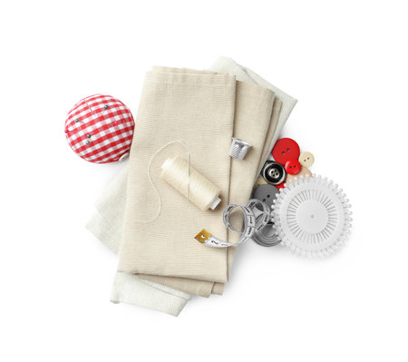 Spool of thread and sewing tools on white background, top viewの写真素材