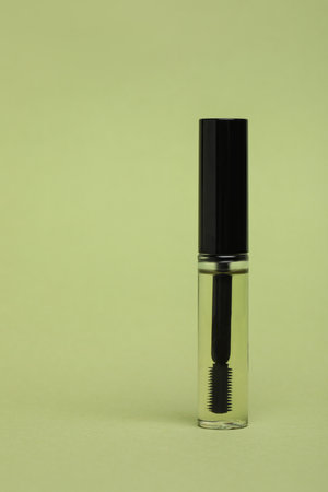 Tube of eyelash oil on light green backgroundの写真素材