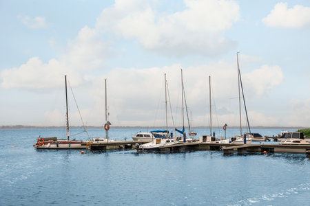 Pier with moored boats in the sea for rent outdoorsの写真素材
