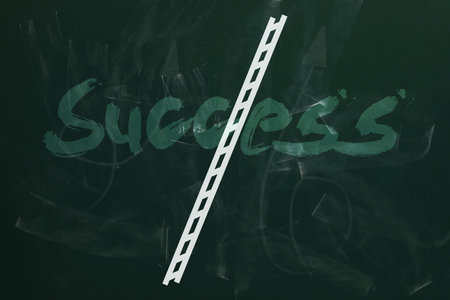 Ladder drawn on green chalkboard. Steps to successの写真素材
