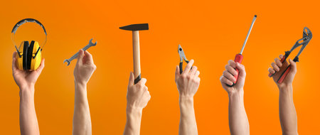 Collage with photos of men holding different construction tools on orange background, closeup. banner designの写真素材