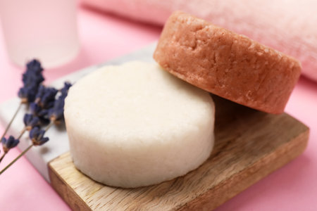 Solid shampoo bars and lavender on pink table, closeup. hair careの写真素材