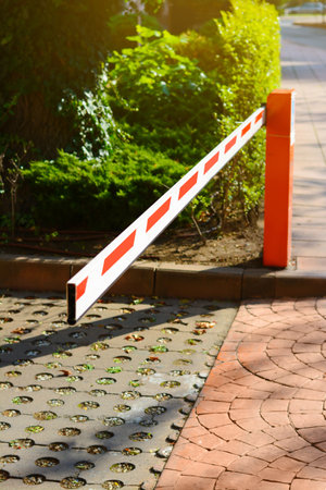 Closed boom barrier on sunny day outdoorsの写真素材