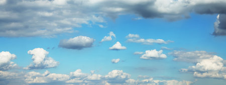 Beautiful blue sky with white fluffy clouds. banner designの写真素材