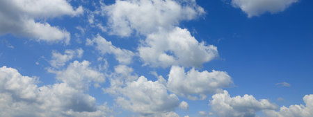 Beautiful blue sky with white fluffy clouds. banner design