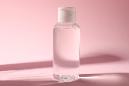 Bottle of micellar water on pink backgroundの写真素材
