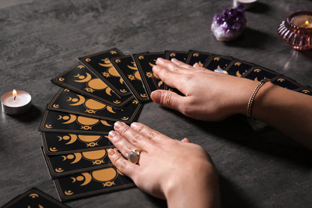Soothsayer predicting the future with tarot cards at table, closeupの写真素材