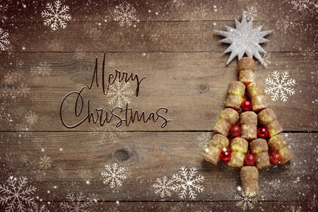 Christmas tree made of wine corks and decor on wooden table, flat lay