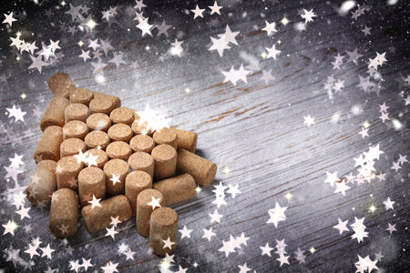Christmas tree made of wine corks on white wooden table. Space for textの写真素材