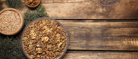 Traditional Christmas slavic dish kutia served on wooden table, flat lay with space for text. banner designの写真素材