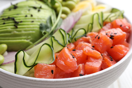 Delicious poke bowl with fish, cucumber and avocado, closeupの写真素材