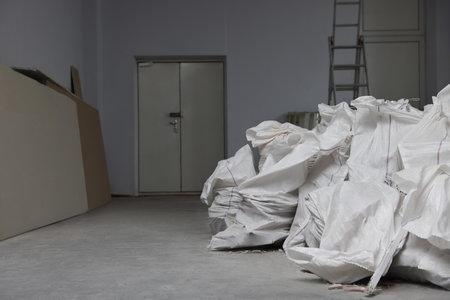 Used building materials in room prepared for renovationの写真素材