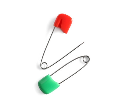 Colorful safety pins on white background, flat layの写真素材