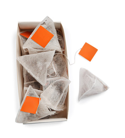 Paper tea bags with tags and box on white background, top viewの写真素材