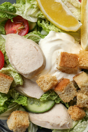 Delicious salad with Chinese cabbage, meat and bread croutons as background, top viewの写真素材